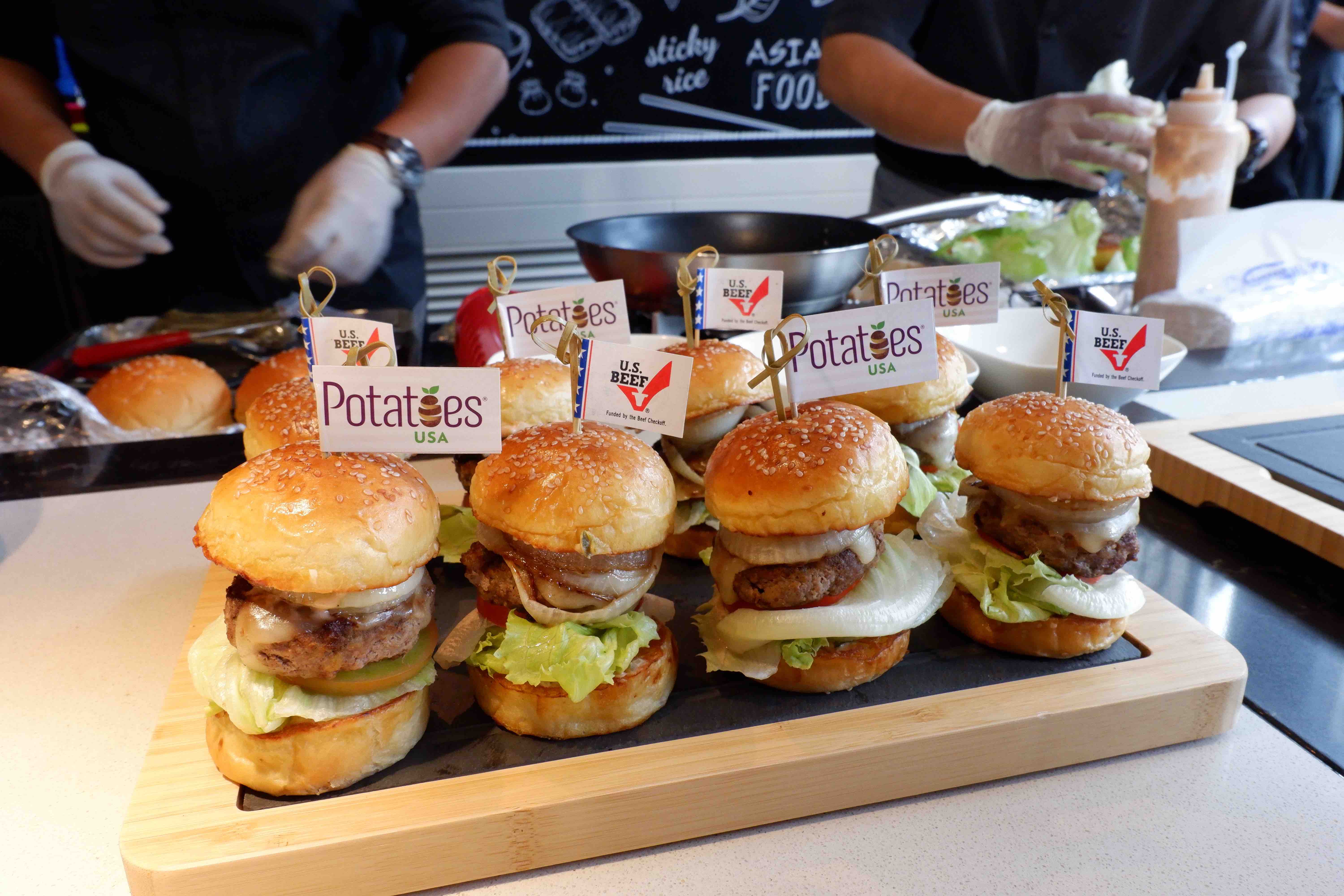 Chef Tristan Ngo's American classic burgers are created with rib eye beef, monterey jack, and cheddar cheese on homemade brioche buns. Photo: Linh To / Tuoi Tre News