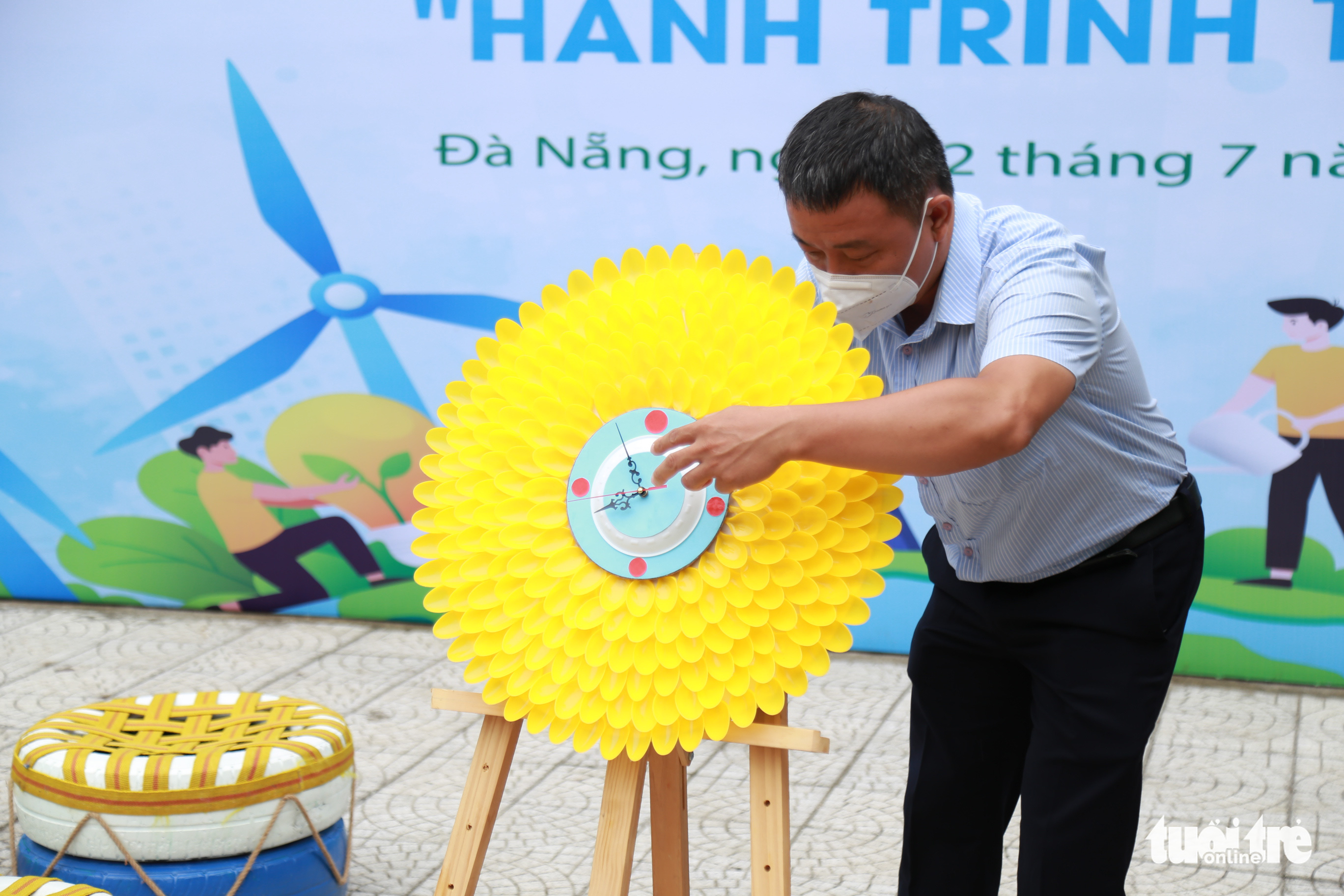 A wall clock made from plastic spoons is presented at the event. Photo: Doan Nhan / Tuoi Tre