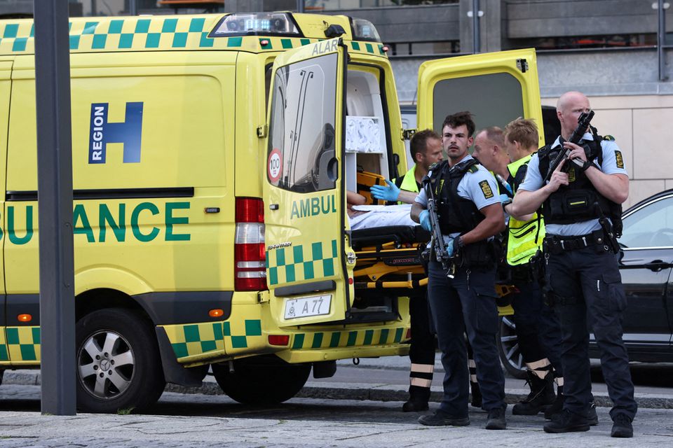 An ambulance and armed police stand outside Field's shopping centre, after Danish police said they received reports of shooting, in Copenhagen, Denmark, July 3, 2022. Ritzau Scanpix/Olafur Steinar Gestsson via Reuters