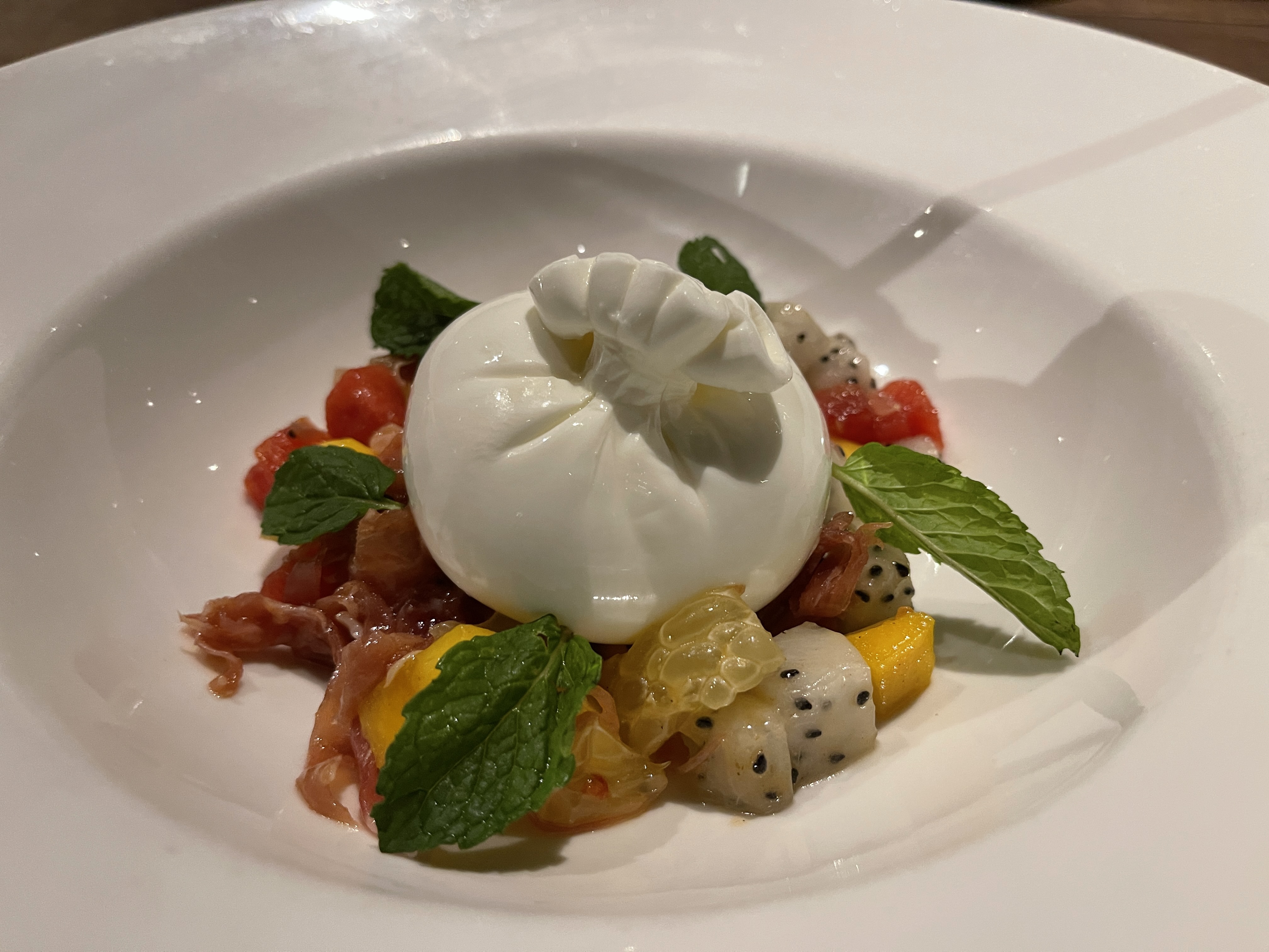 The signature fruit salad with house-made burrata is served at a Pizza 4P's restaurant in District 3, Ho Chi Minh City. Photo: Dong Nguyen / Tuoi Tre News