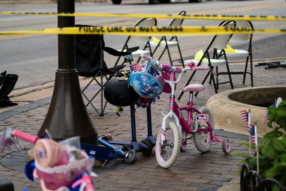 A child's bike is left behind after a mass shooting at a Fourth of July parade route in the wealthy Chicago suburb of Highland Park, Illinois, U.S. July 4, 2022. Photo: Reuters