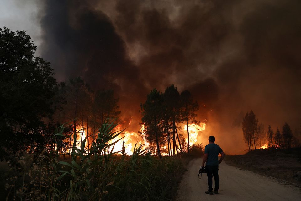Firefighters scramble to put out flames in heatwave-hit Portugal, Spain