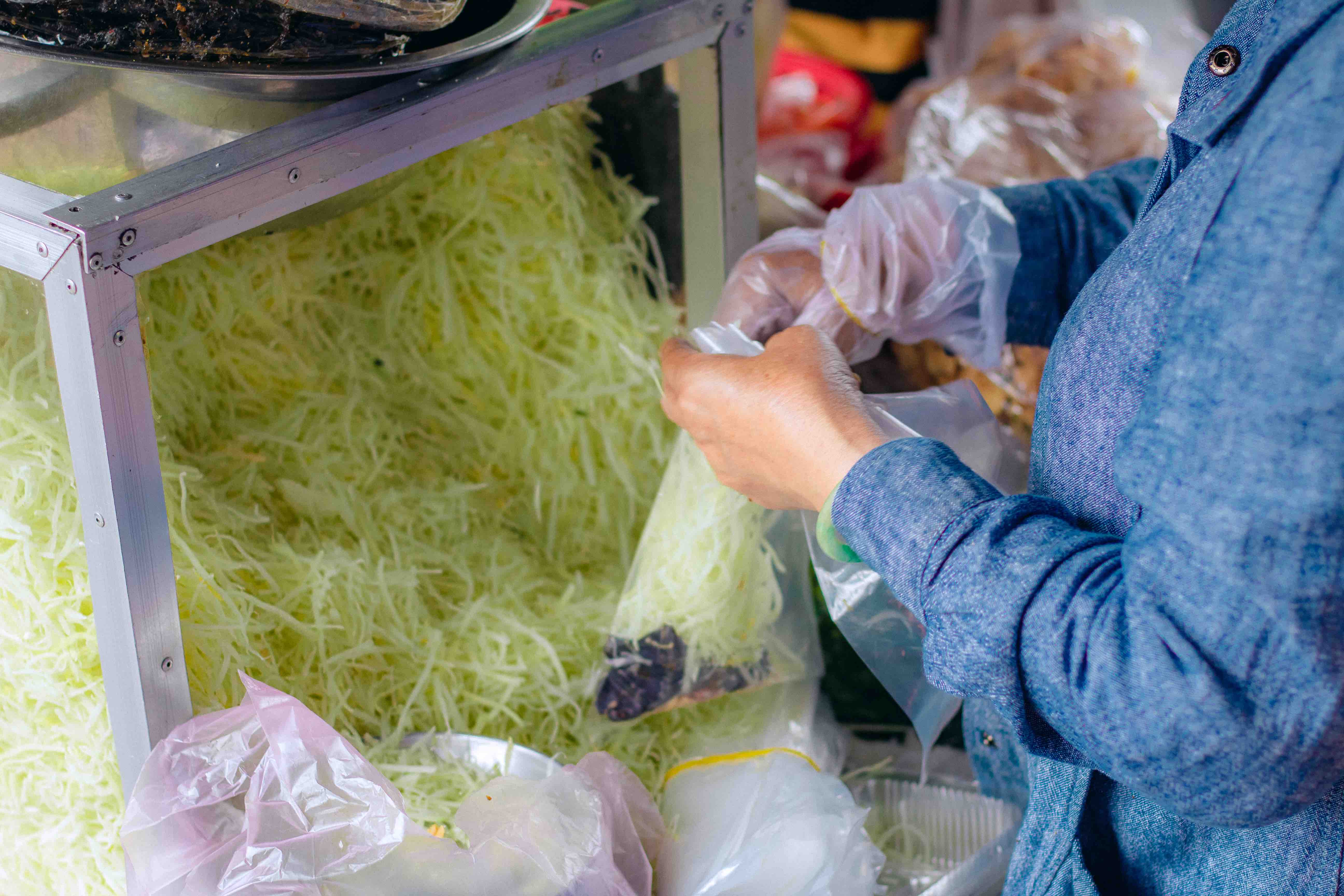 Thuy prepares to serve goi kho bo at her stall on Hai Ba Trung Street, District 1, Ho Chi Minh City. Photo: Chau Ha / Tuoi Tre