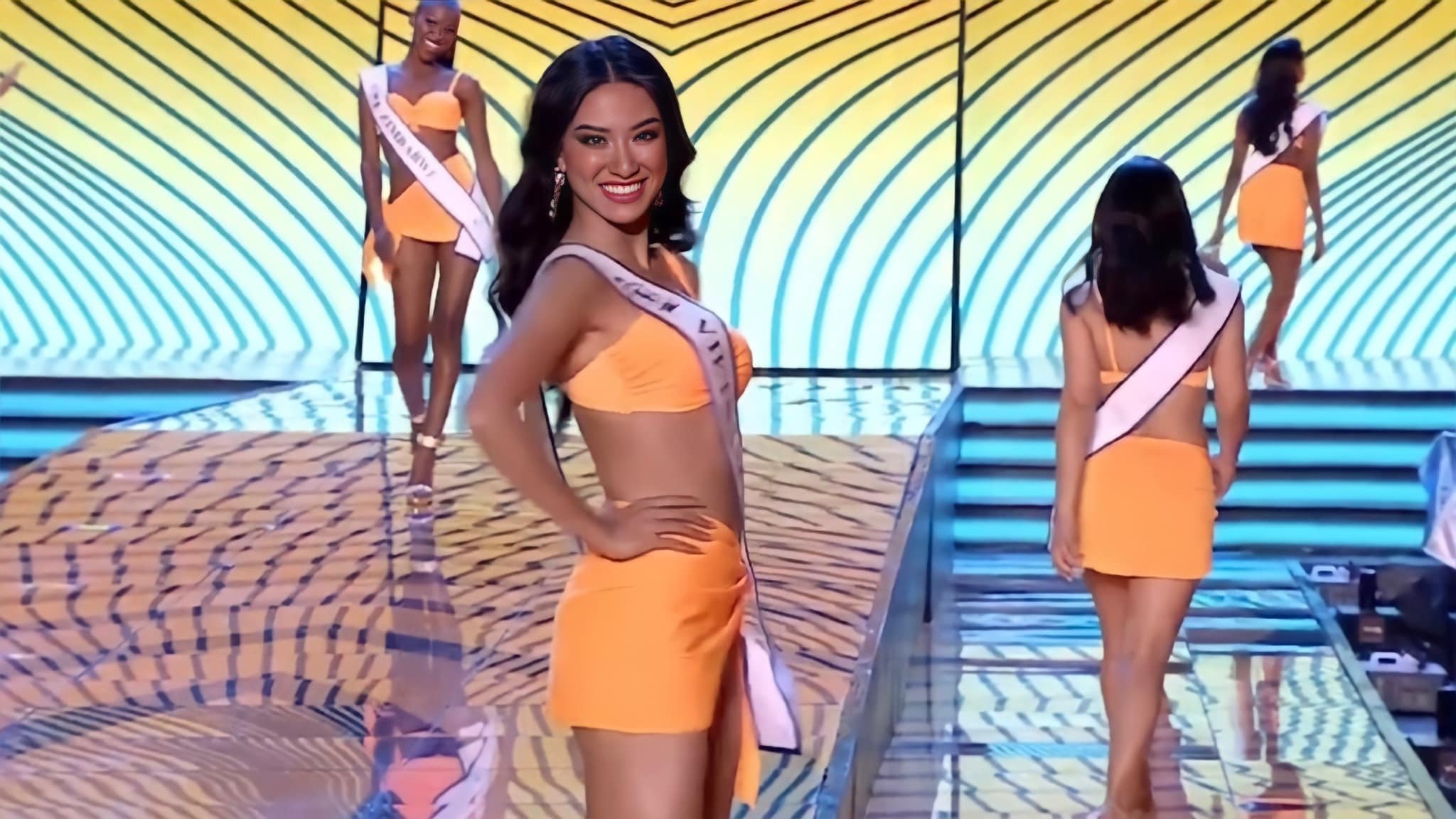 This screenshot shows Vietnam's Nguyen Huynh Kim Duyen donning a swimwear at the grand coronation ceremony of Miss Supranational 2022 in Poland, July 16, 2022.