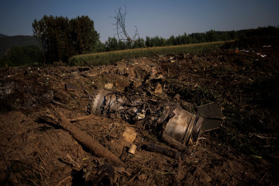 Debris is seen at the crash site of an Antonov An-12 cargo plane owned by a Ukrainian company, near Kavala, Greece, July 17, 2022. Photo: Reuters