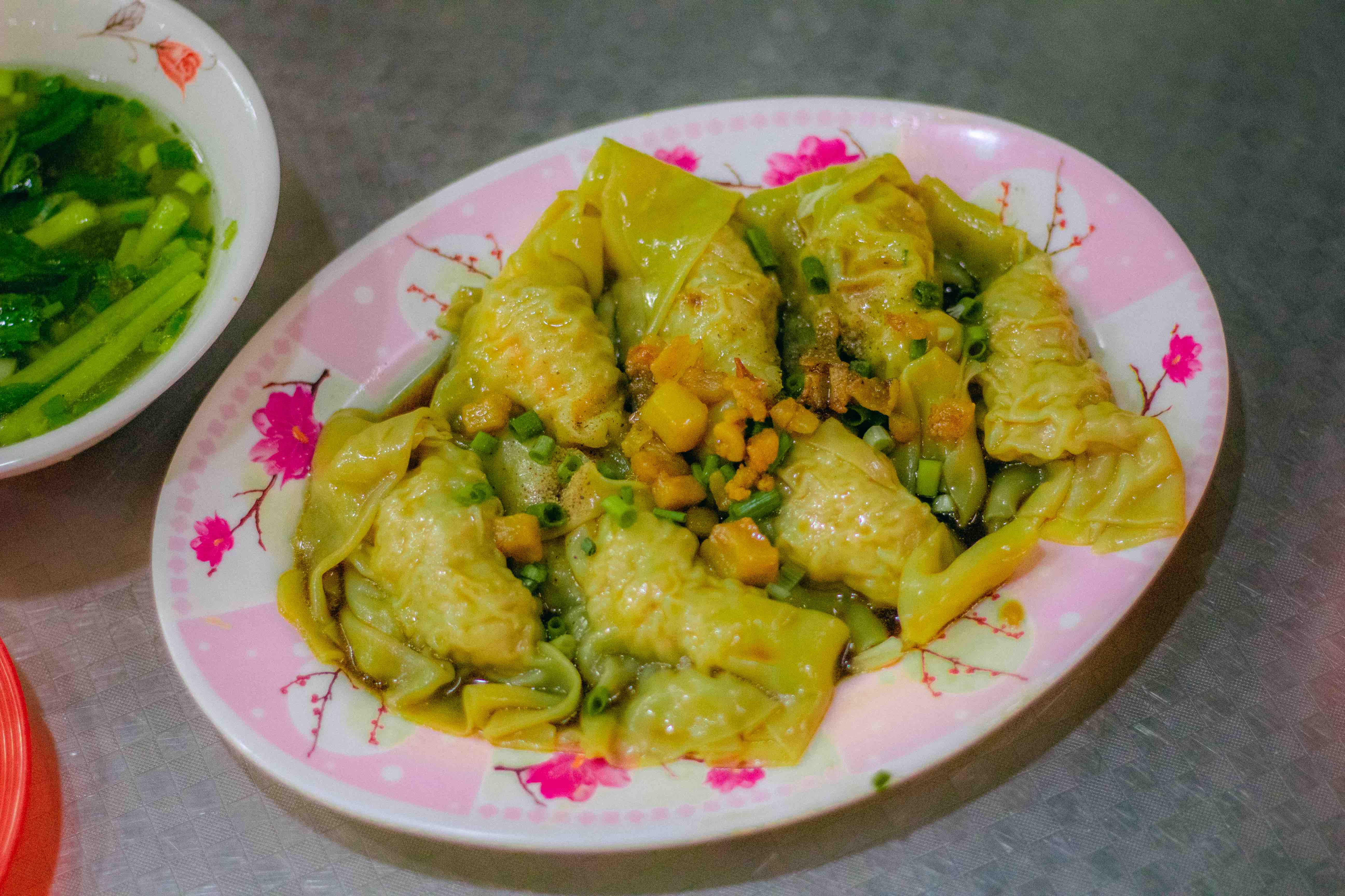 A dish of stir-fried shuijiao with oyster sauce topped with pork greaves at 162 Ha Ton Quyen Street, District 11, Ho Chi Minh City, Vietnam. Photo: Linh To / Tuoi Tre News