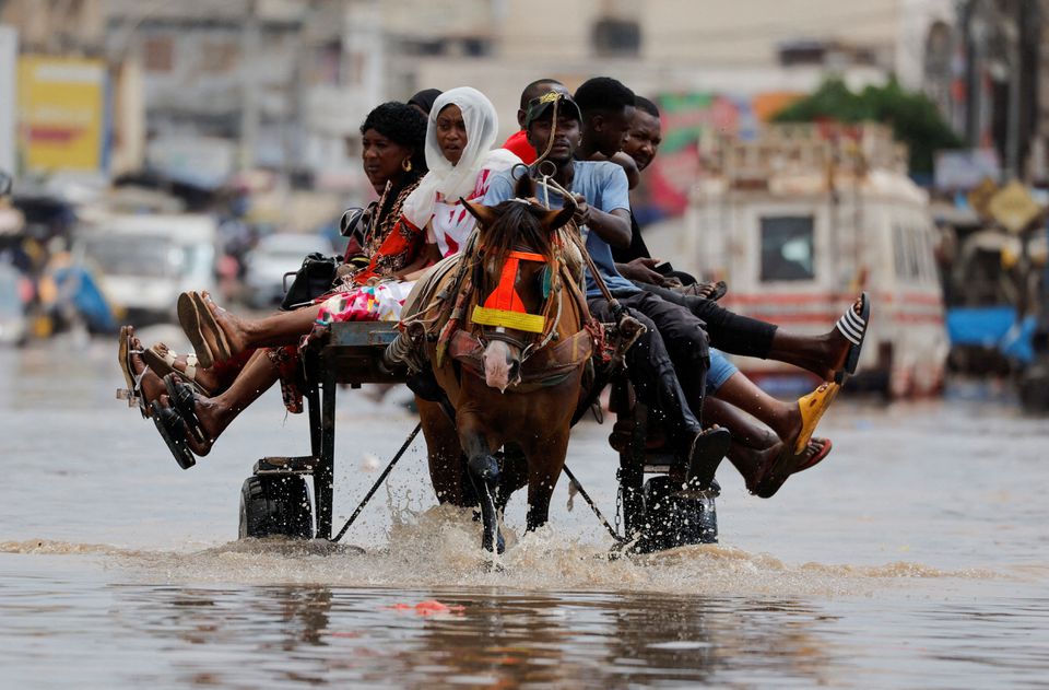 Senegal capital wades through floodwater after heavy rain