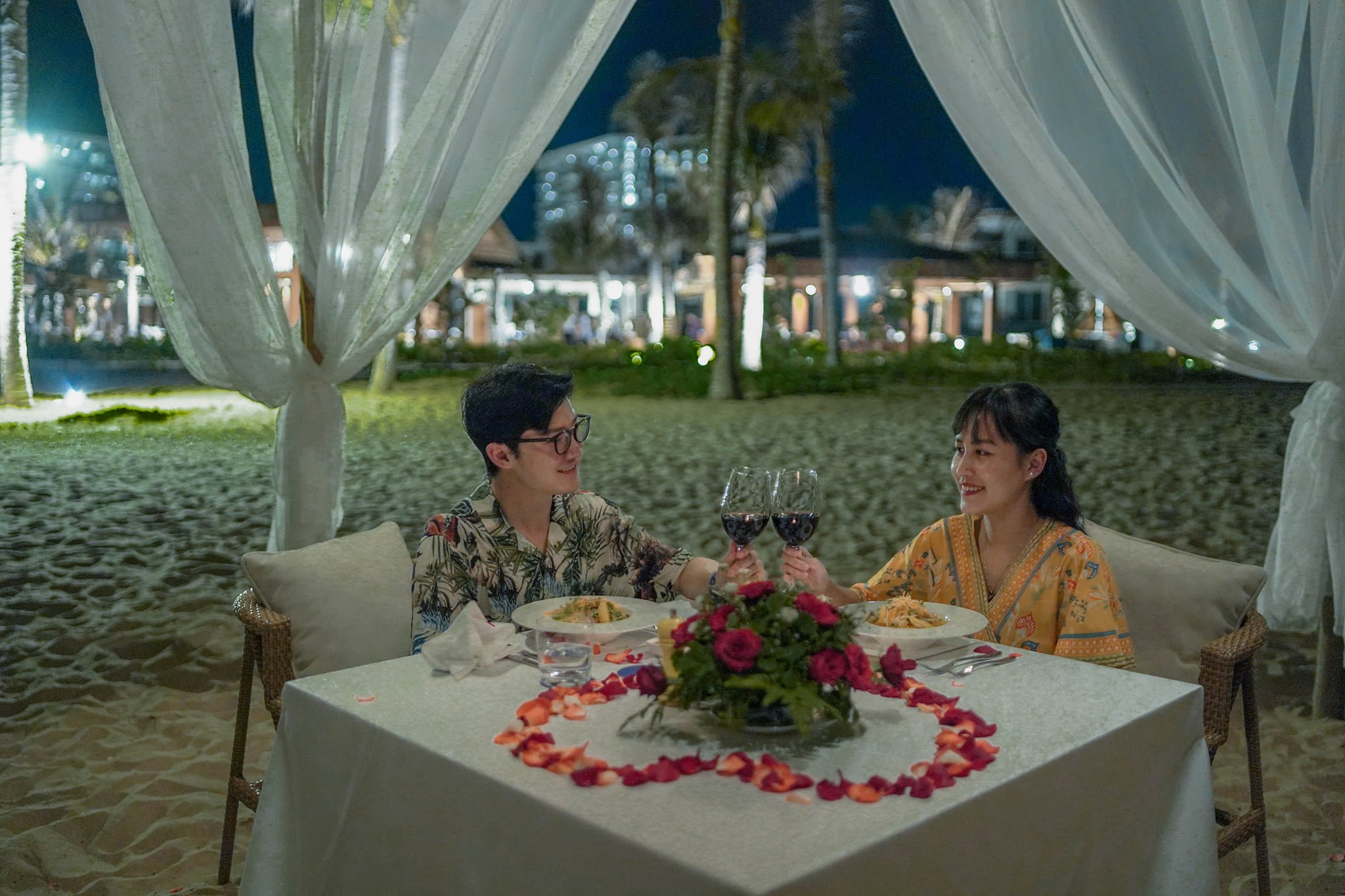 A couple enjoys a private dinner on the beach at a resort in Khanh Hoa Province, Vietnam. Photo: Tuan Han / Tuoi Tre