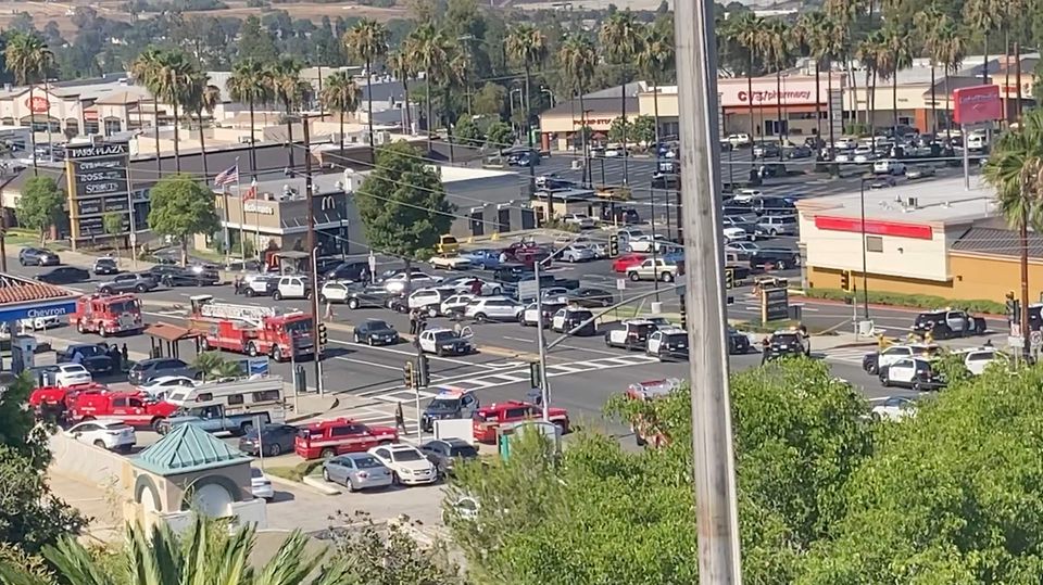 Emergency vehicles and personnel work following a shooting at Peck Park, San Pedro, Los Angeles, California, U.S., July 24, 2022 in this screen grab taken from a handout video. Photo: Cat Le Day/Handout via REUTERS