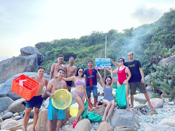 A group of friends poses while collecting garbage on a beach in Ninh Thuan Province, south-central Vietnam. Photo: Supplied