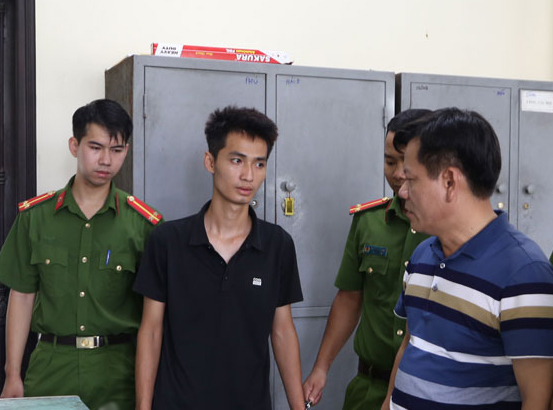 Nguyen Truong Giang is held at the police station in Ha Nam Province, Vietnam in this supplied photo.