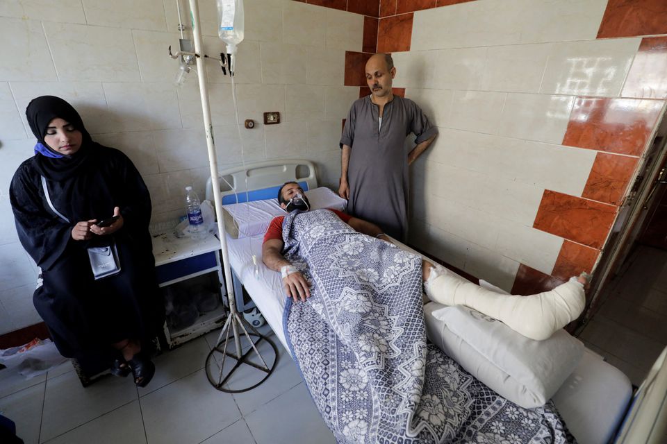 A victim of the deadly fire that broke out at the Abu Sifin church receives medical treatment at a hospital in Giza, Egypt, August 14, 2022. Photo: Reuters