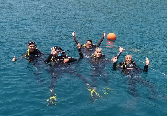 A group of tourists are pictured on their diving trip in the Hon Mun Marine Reserve.