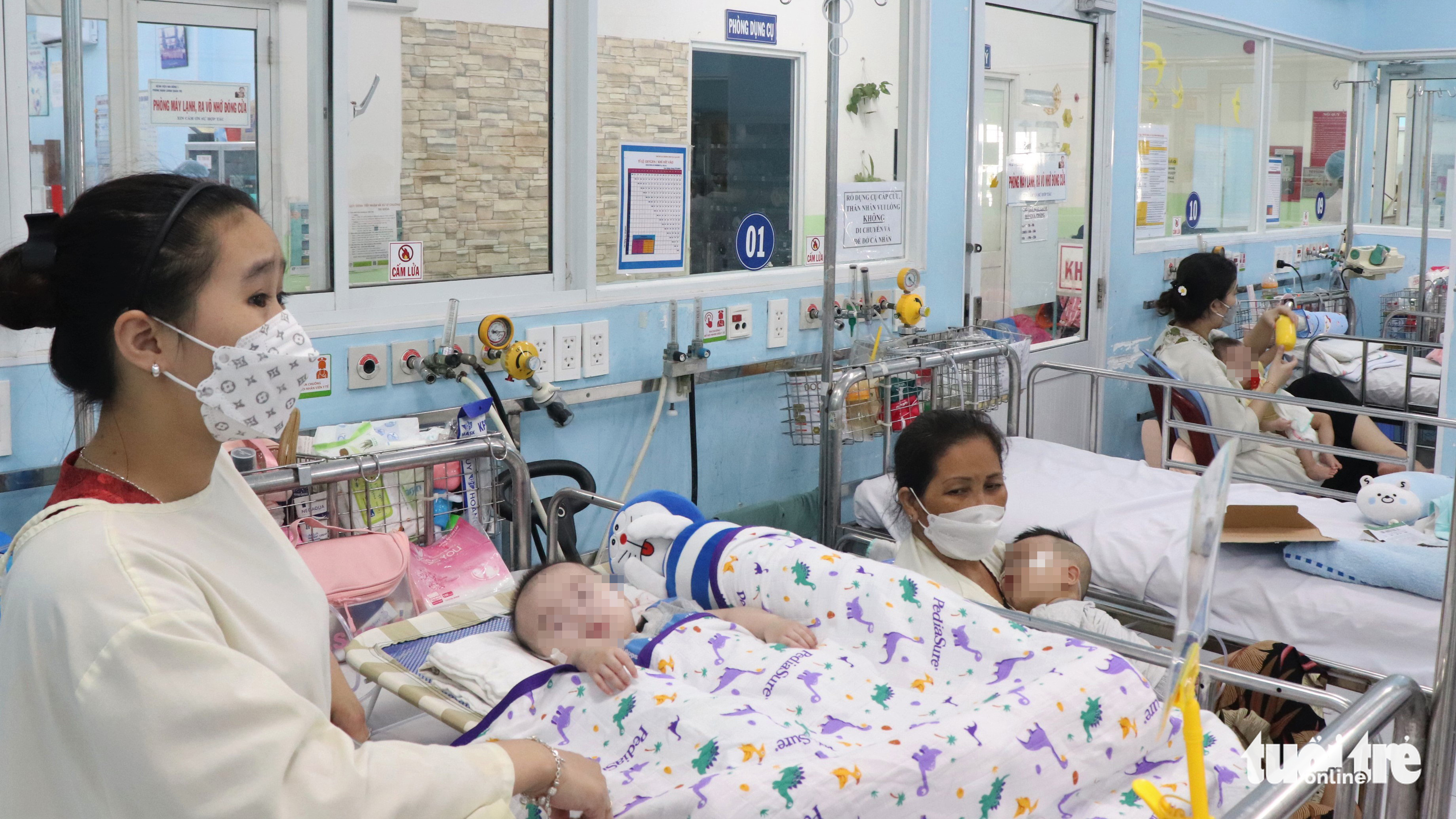 Hospitals run out of beds as respiratory diseases spike among children in Hanoi, Saigon