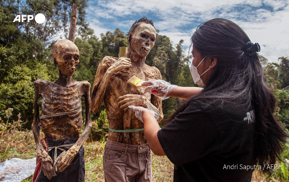 Hundreds of corpses are pulled out and dressed in the village of Torea as part of the ritual to honour their spirits and provide offerings. Photo: AFP