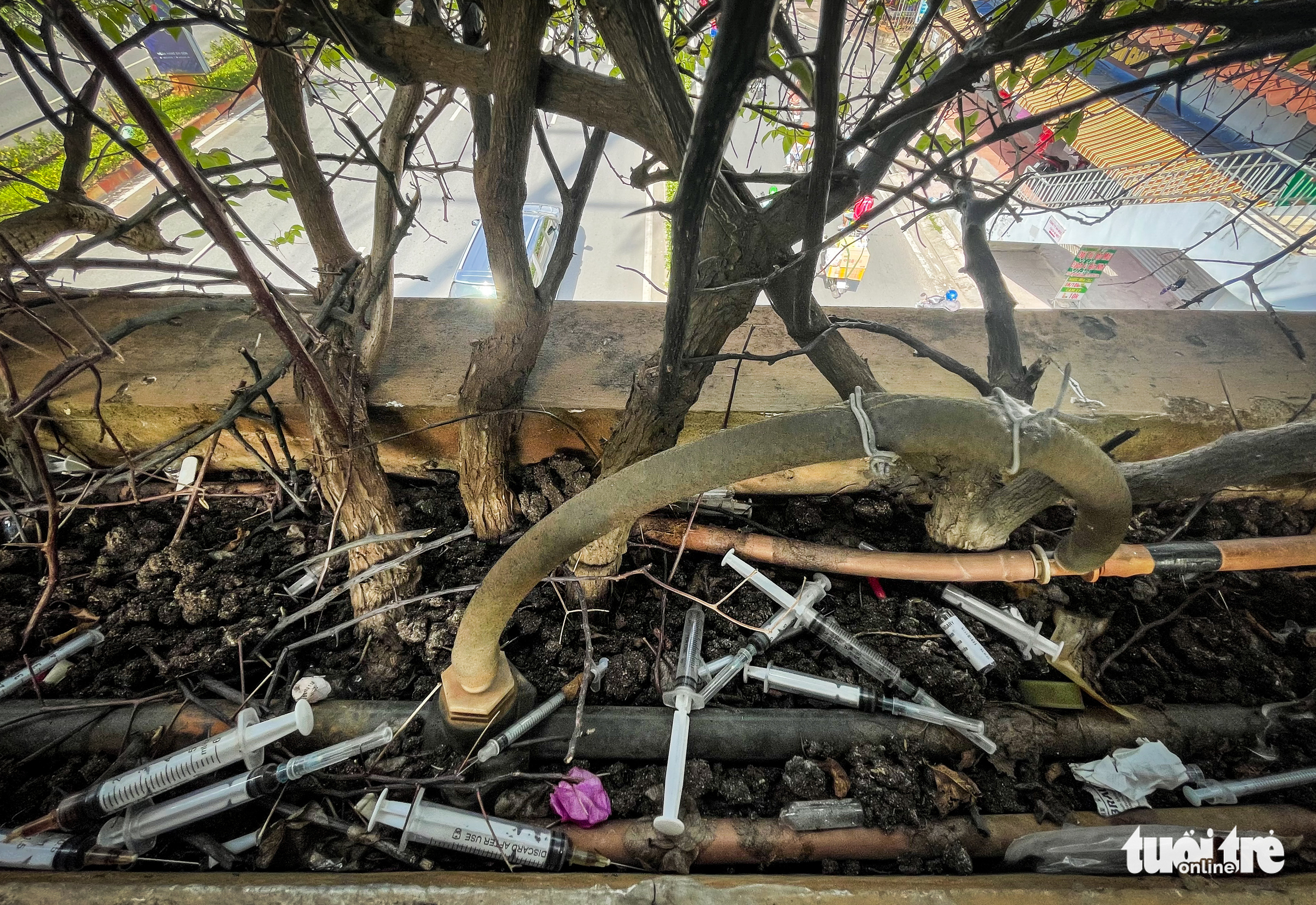 Used syringes are pictured on a footbridge in Ho Chi Minh City, August 19, 2022. Photo: Chau Tuan / Tuoi Tre