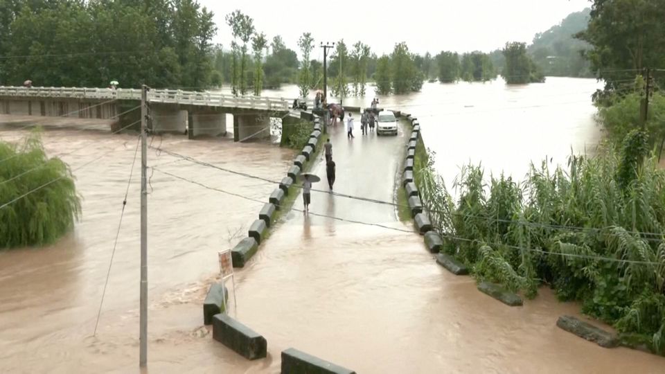 A general view of a flooded bridge following heavy rains in Mandi, Himachal Pradesh, India August 20, 2022 in this screen grab obtained from a video. Photo: ANI via REUTERS