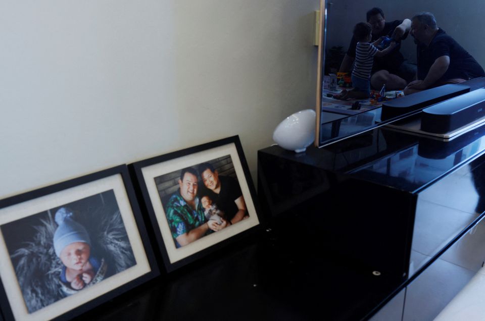 Same-sex parents Andre Ling, 44, and Cameron Sutherland, 47, play with their two year old son Tyler at home in Singapore, August 22, 2022. Photo: Reuters