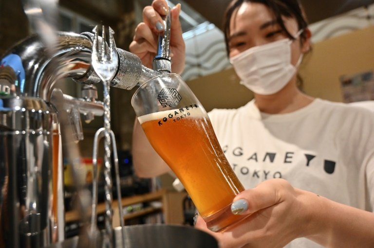 Serving craft beer has helped to attract a younger clientele to the bathhouses. Photo: AFP