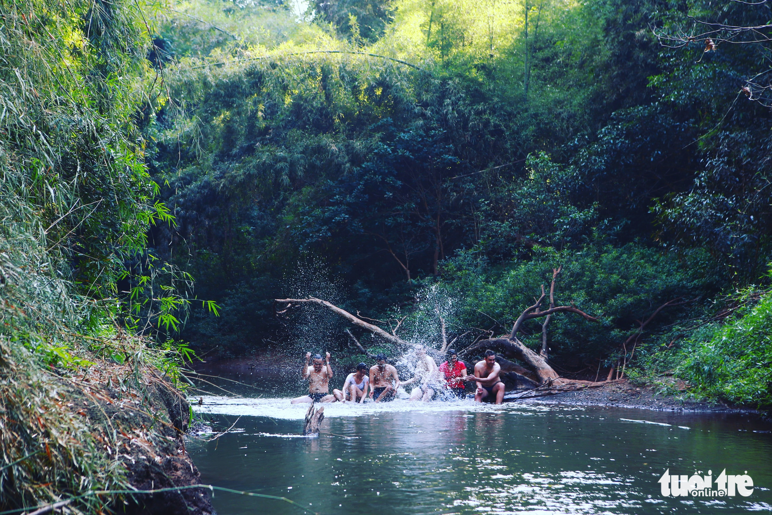 Visitors bathe in a stream at Ma Da Forest in Dong Nai Province, Vietnam. Photo: Gia Tien / Tuoi Tre