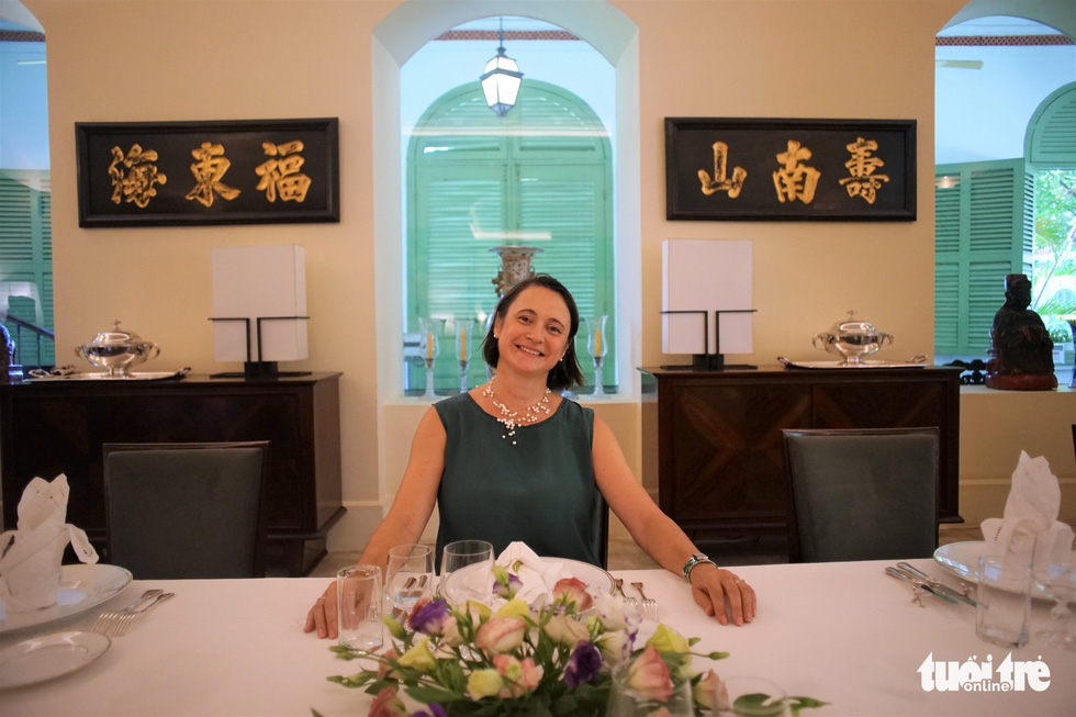 French Consul General in Ho Chi Minh City Emmanuelle Pavillon-Grosser sits at the French-styled banquet table in the large dining room at the Consulate General of France in Ho Chi Minh City on September 17, 2022. Photo: Huynh Vy / Tuoi Tre