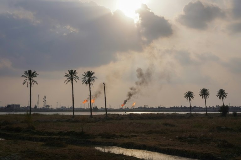 Climate victim: oil well flare near the southern Iraqi city of Basra. The country is one of the worst hit by global warming. Photo: AFP