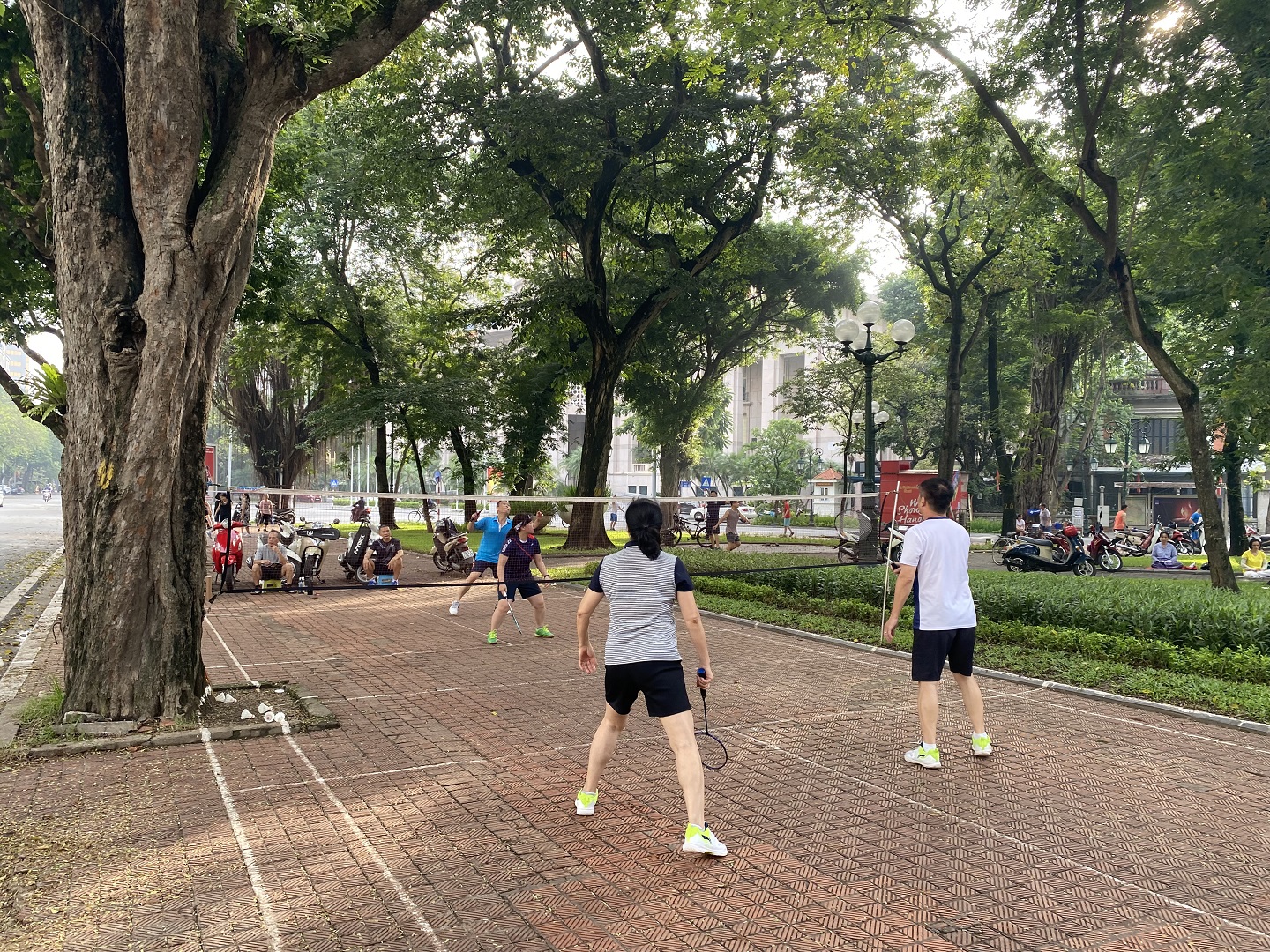 Local residents play badminton at a park in Hanoi, Vietnam. Photo: Kathryn Romeyn