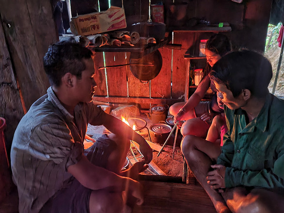 Nguyen Thanh Chim, head of Village 3, and his family members live in a badly lit house due to the absence of electricity.