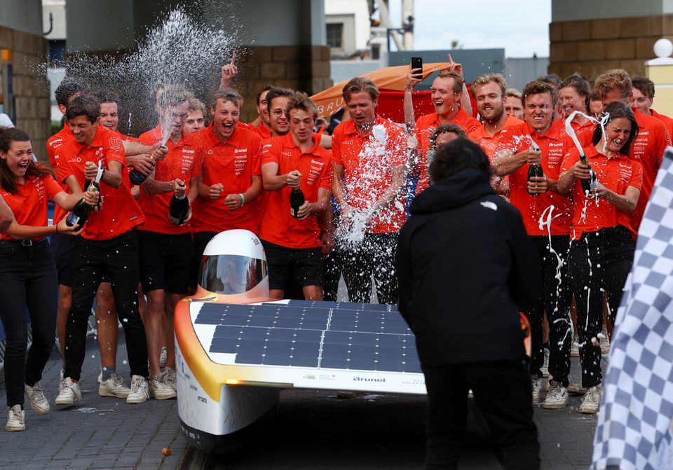 Netherlands' Brunel Solar Team celebrates at the finish line, after completing the final stage of the 2022 Sasol Solar Challenge race, at the V&A Waterfront, in Cape Town, South Africa, September 16, 2022. Photo: Reuters