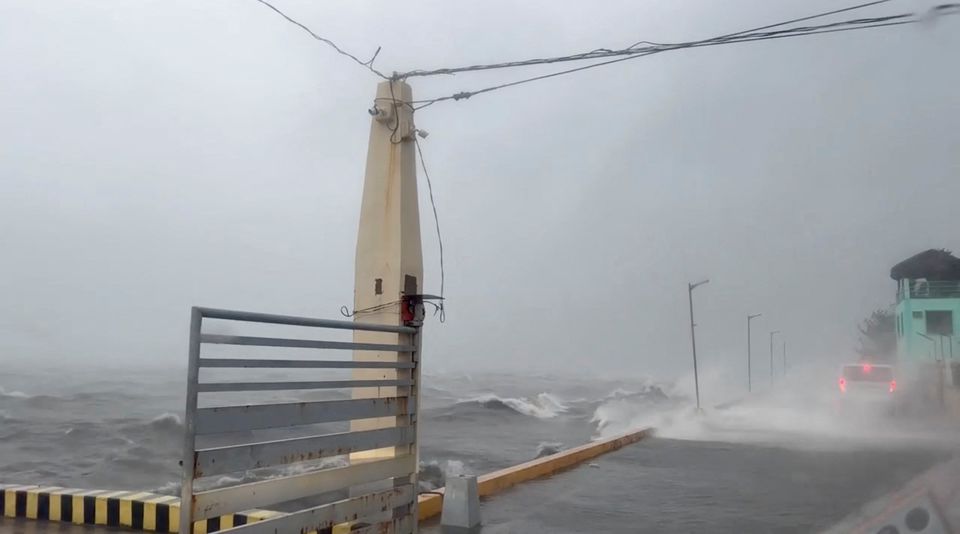 Waves crashes into road on coastline during heavy storm in Polillo, Quezon Province, Philippines September 25, 2022 in this still image obtained from a video. Photo: Lgu Polillo Handout/via REUTERS
