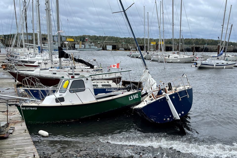 A sailboat lies washed up next to a small craft following the passing of Hurricane Fiona, later downgraded to a post-tropical storm, in Shearwater, Nova Scotia, Canada September 24, 2022. Photo: Reuters