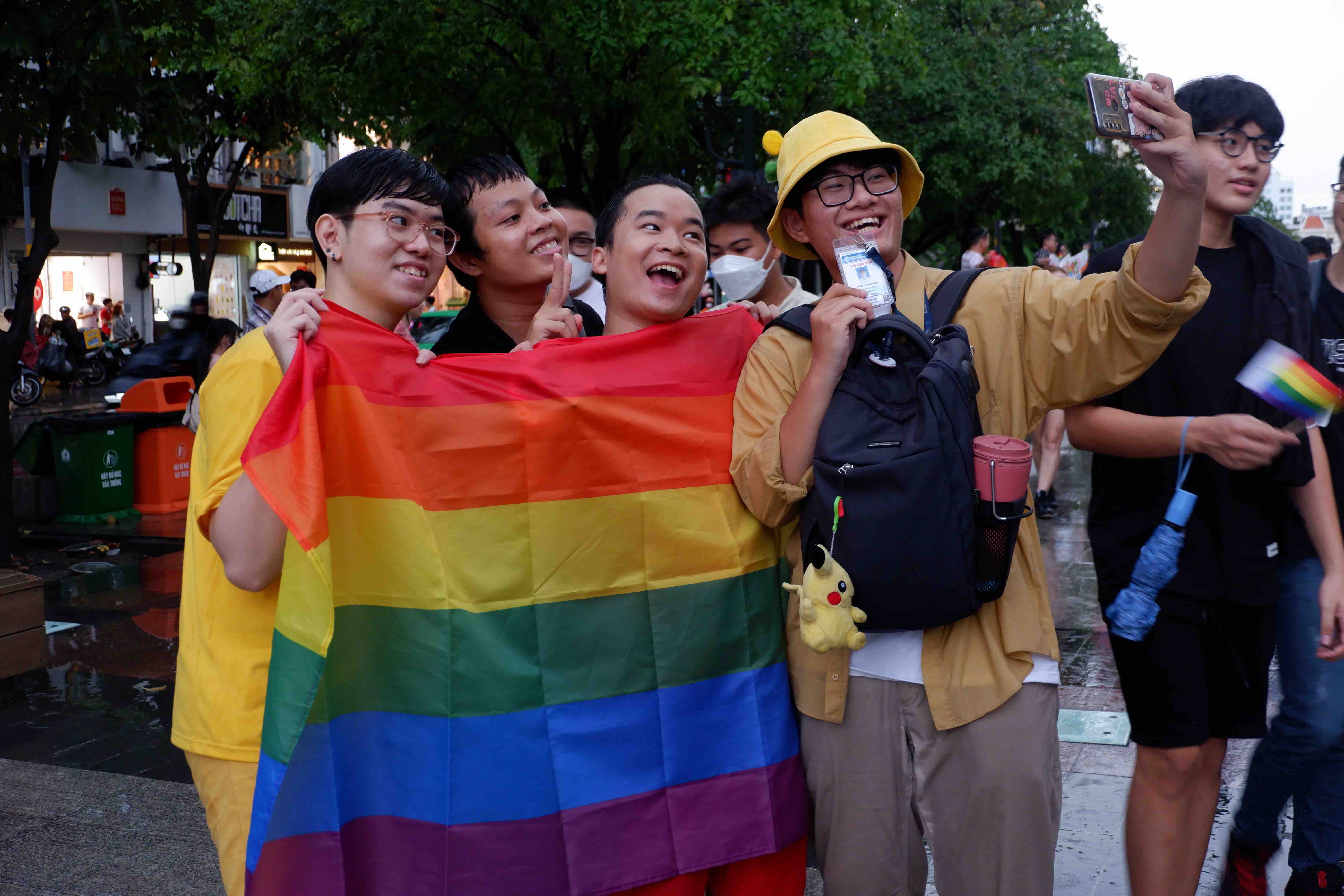 A group of friends pose for a selfie photo at VietPride 2022 parade in Ho Chi Minh City on October 1, 2022. Photo: Linh To / Tuoi Tre News
