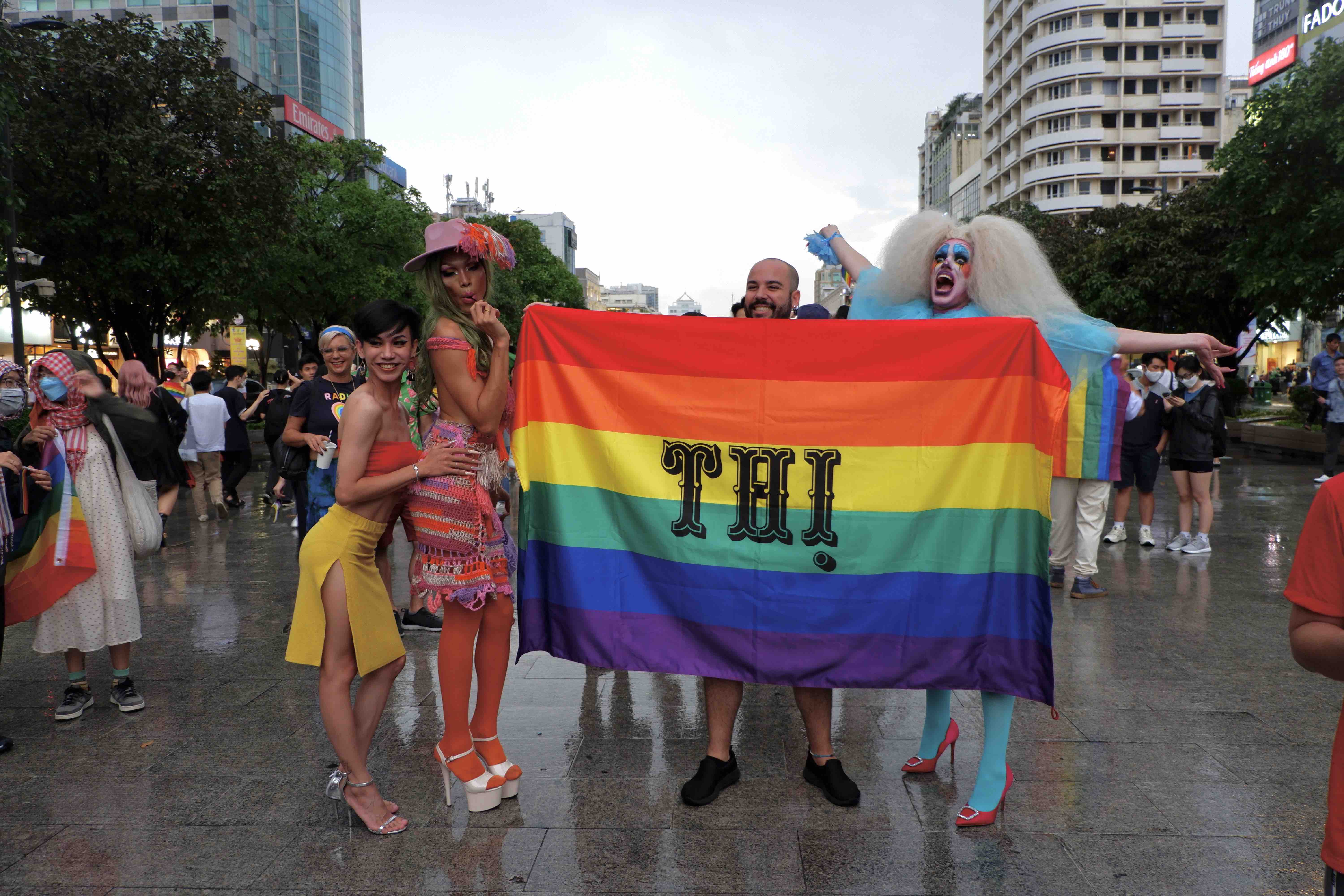 Participants hold a flag to show support for freedom and equality LGBT community during the VietPride parade in Ho Chi Minh City on October 1, 2022. Photo: Linh To / Tuoi Tre News
