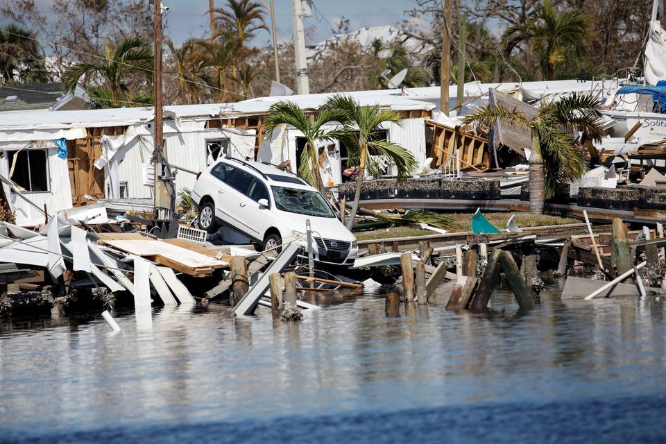 A destroyed car is seen in the Matanzas Pass after Hurricane Ian caused widespread destruction in Fort Myers Beach, Florida, U.S., October 1, 2022. Photo: Reuters