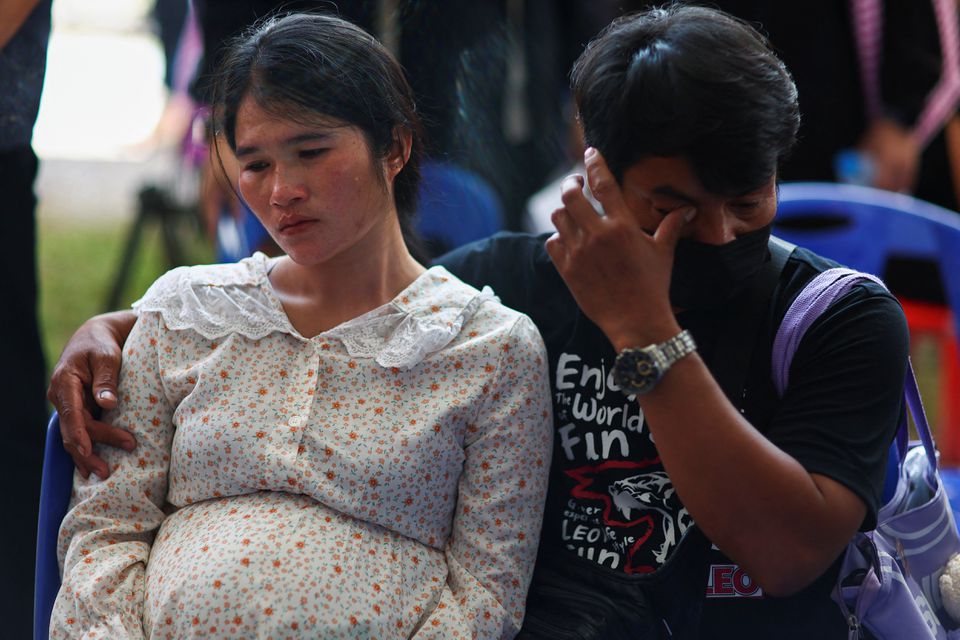 Parents of a victim react as they gather outside the day care centre which was the scene of a mass shooting, in the town of Uthai Sawan, around 500 km northeast of Bangkok, in the province of Nong Bua Lam Phu, Thailand October 7, 2022. Photo: Reuters
