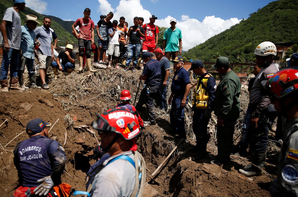 Rescue members work following floods due to heavy rains, in Las Tejerias, Aragua state, Venezuela October 10, 2022. REUTERS/Leonardo Fernandez Viloria