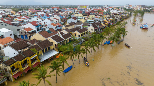 Tourists take boat tours in Vietnam’s flooded Hoi An Ancient Town
