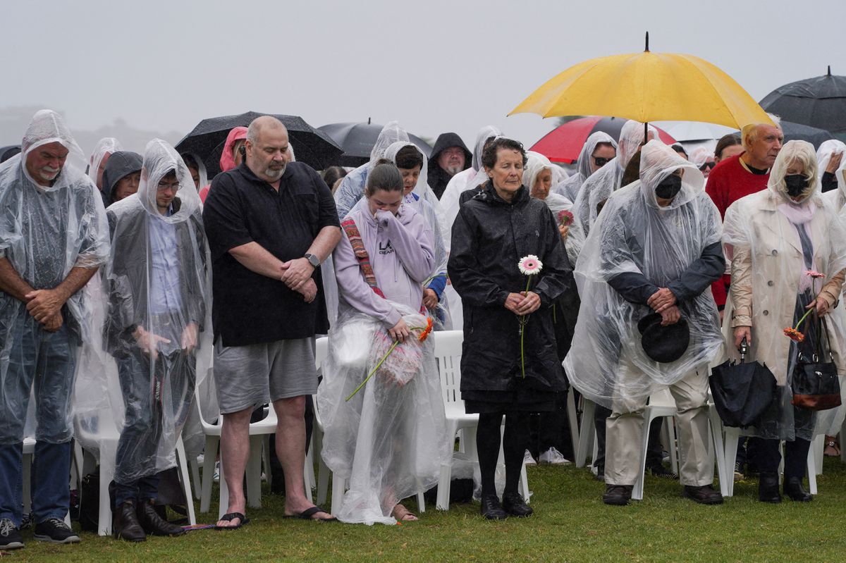 Mourners gather for a memorial service to mark the 20th anniversary of the Bali bombings, which killed 202 people including 88 Australians, at Coogee Beach in Sydney, Australia, October 12, 2022. REUTERS/Loren Elliott