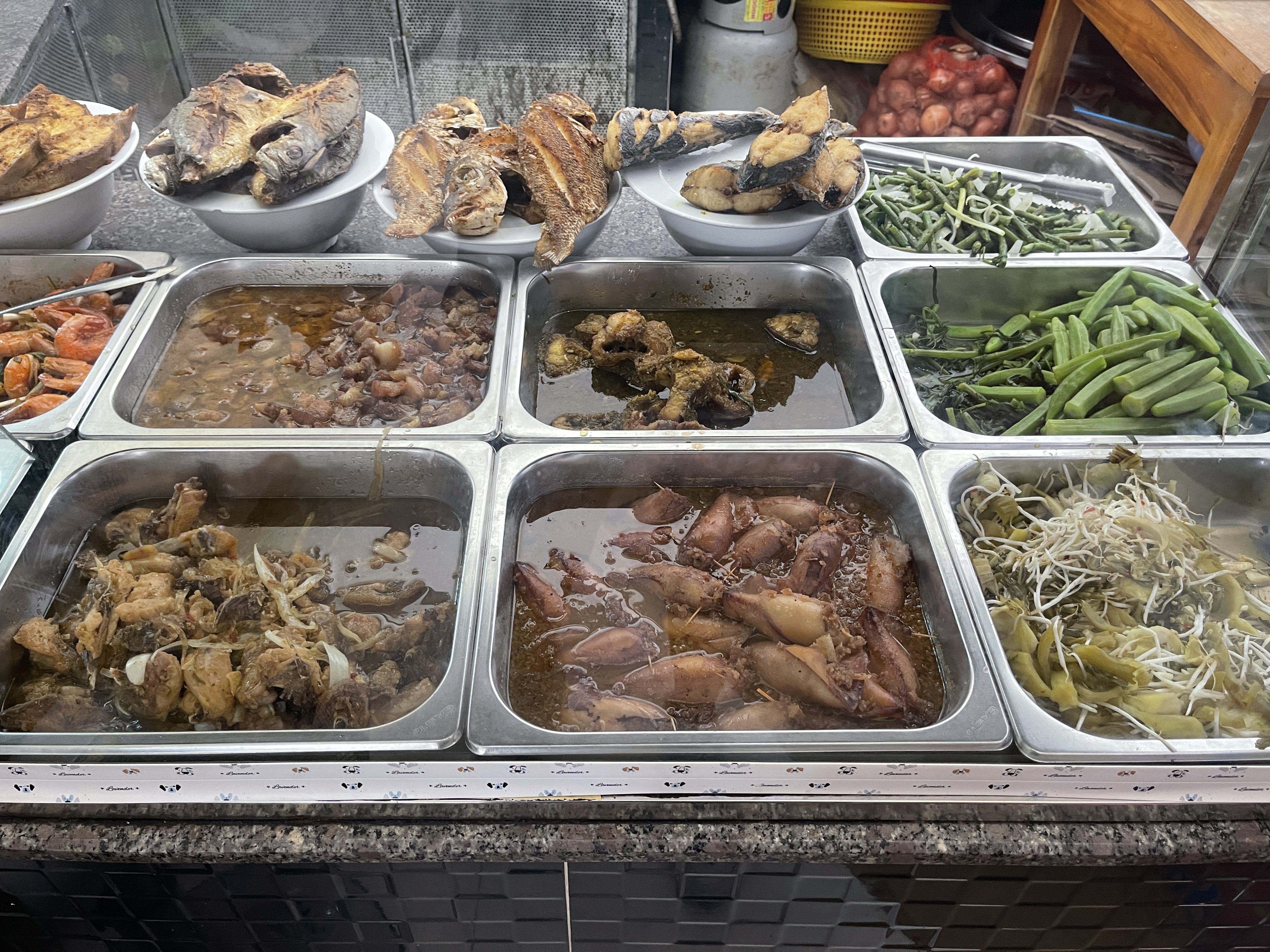 Vietnamese dishes are displayed on the food counter at Cơm Nuna shop in Phu Quoc, Vietnam. Photo: Dong Nguyen / Tuoi Tre News
