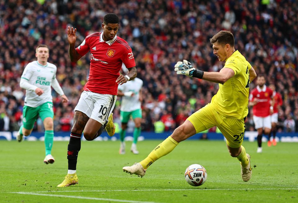 Soccer Football - Premier League - Manchester United v Newcastle United - Old Trafford, Manchester, Britain - October 16, 2022 Manchester United's Marcus Rashford in action with Newcastle United's Nick Pope. Photo: Reuters