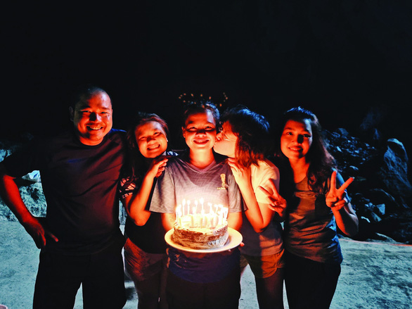 H’Anetta (center) smiles as Oxalis staff members surprisingly celebrate her 100th expedition to Son Doong Cave in 2021. Photo: Supplied