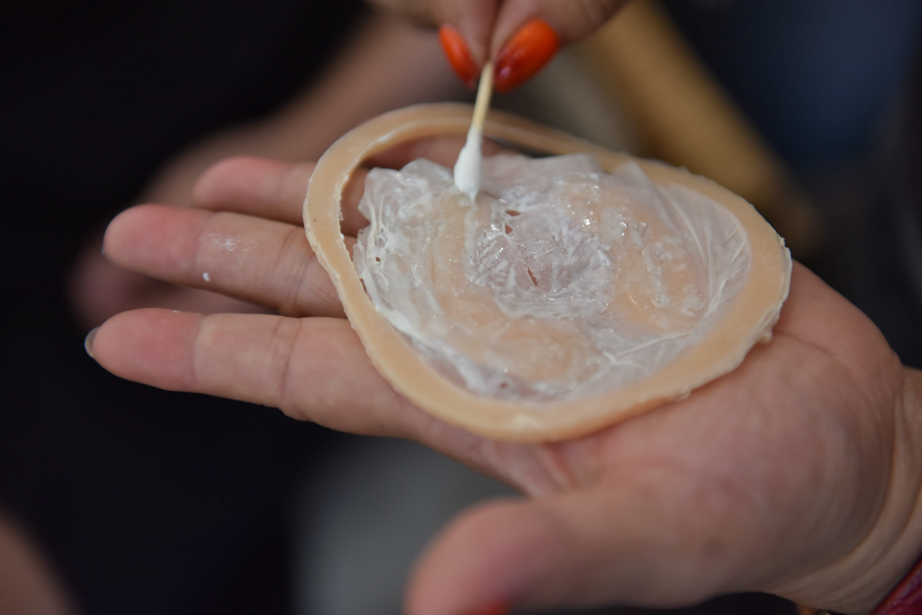 Hang fixes a piece of silicon meant to resemble a zombie bite. In the past, when Hang had little access to high-grade materials, she used rice paper soaked in water to create wounds. Photo: Ngoc Phuong / Tuoi Tre News