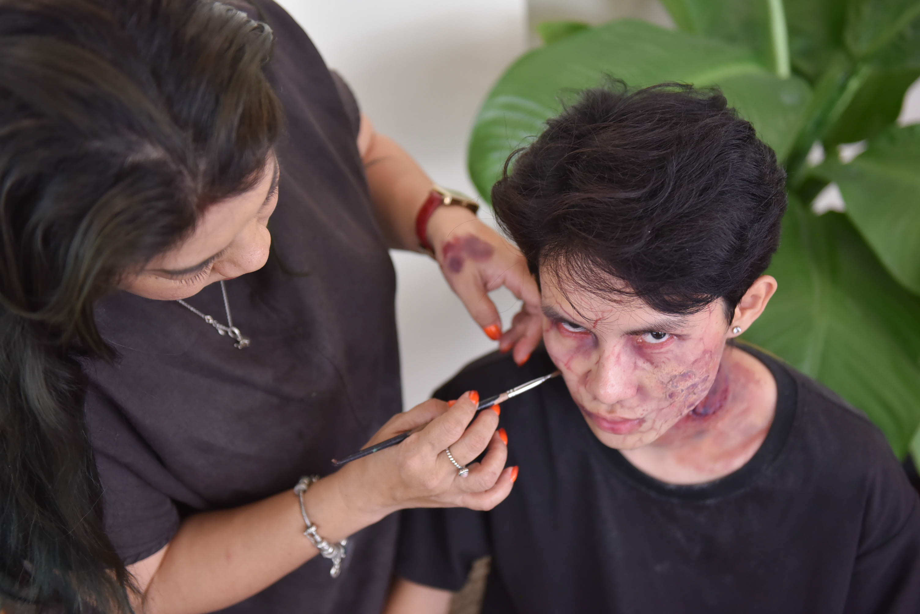 Nguyen Thi Thanh Hang does makeup for a zombie movie. Photo: Ngoc Phuong / Tuoi Tre News