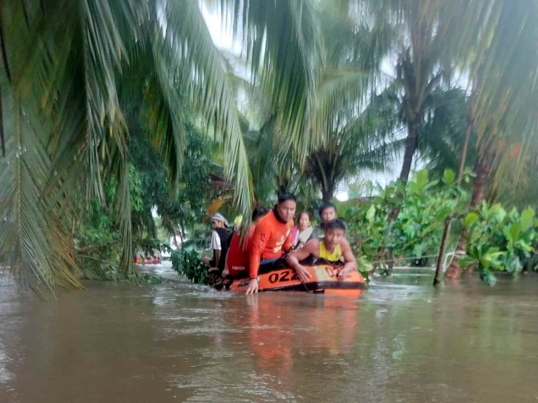 Philippine Coast Guard (PCG) rescuers evacuate residents from their flooded homes due to a tropical storm, locally named Paeng, in Sultan Kudarat province, Philippines, October 28, 2022. Philippine Coast Guard/Handout via Reuters
