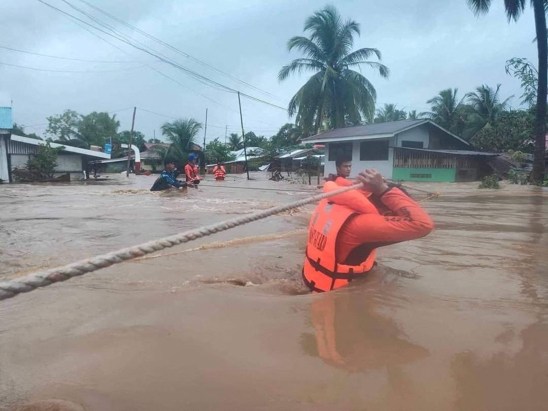 Philippine Coast Guard (PCG) rescuers evacuate residents from their flooded homes due to a tropical storm, locally named Paeng, in Maguindanao province, Philippines, October 28, 2022. Philippine Coast Guard/Handout via Reuters