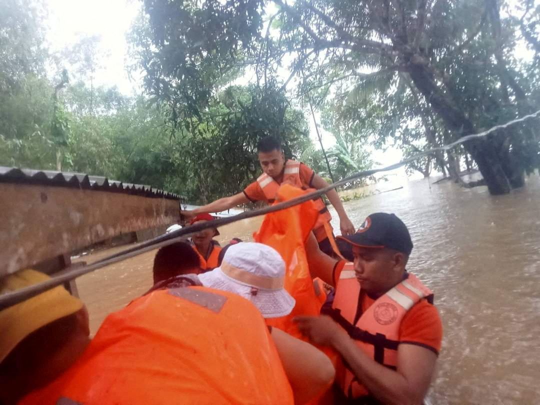 Philippine Coast Guard (PCG) rescuers evacuate residents from their flooded homes due to a tropical storm, locally named Paeng, in Maguindanao province, Philippines, October 28, 2022. Philippine Coast Guard/Handout via Reuters