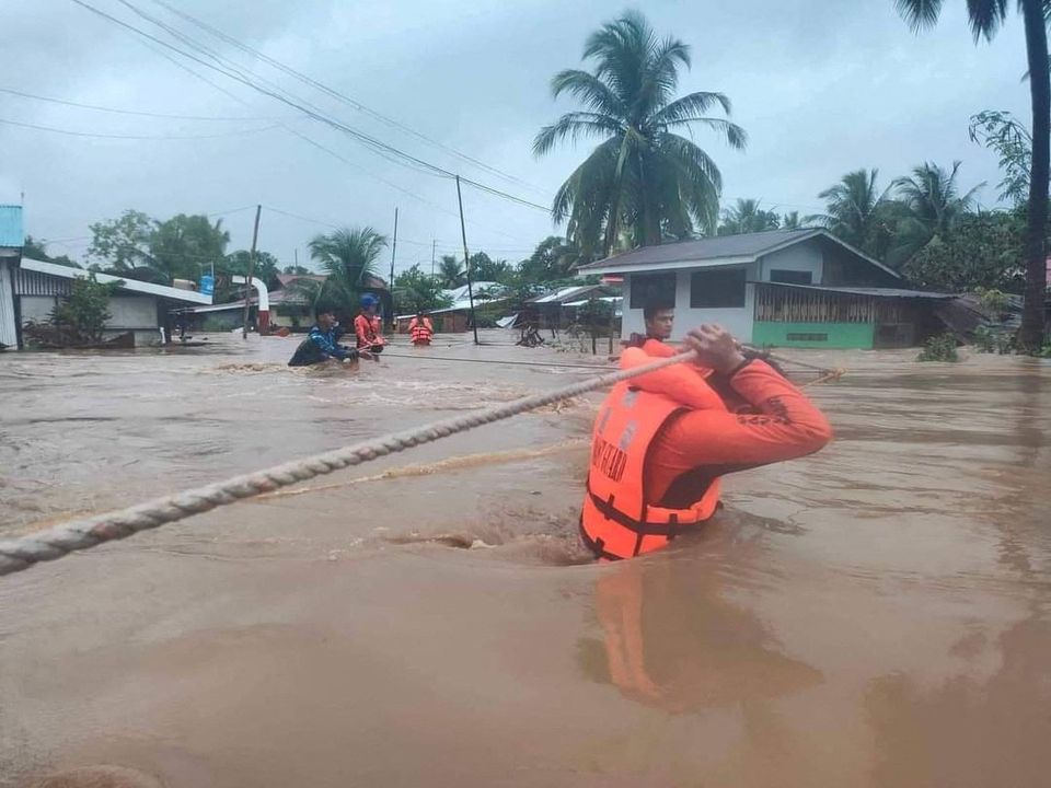 Philippine Coast Guard (PCG) rescuers evacuate residents from their flooded homes due to a tropical storm, locally named Paeng, in Maguindanao province, Philippines, October 28, 2022. Philippine Coast Guard/Handout via Reuters