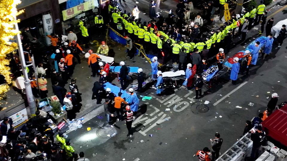 Rescue workers work at the scene where a stampede during Halloween festivities killed an injured many people at the popular Itaewon district in Seoul, South Korea, October 30, 2022. Photo: Yonhap via Reuters