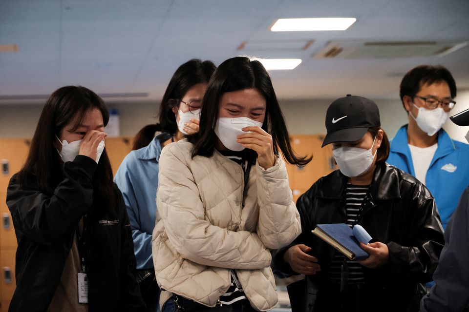 Family members of people missing after a stampede during Halloween festivities, gather at a community service center in Seoul, South Korea, October 30, 2022. Photo: Reuters