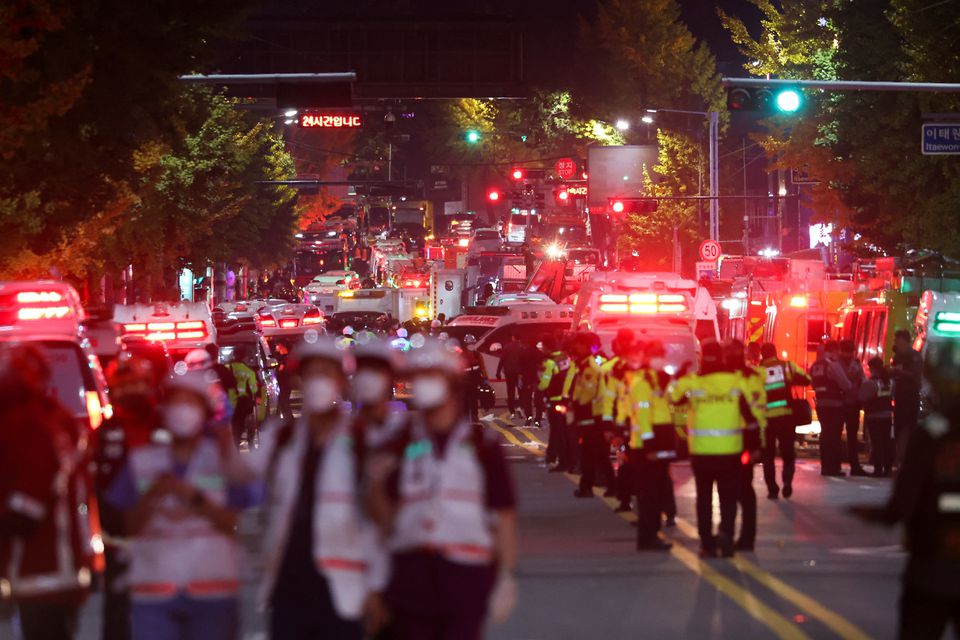 Rescue teams work at the scene where dozens of people were injured in a stampede during a Halloween festival in Seoul, South Korea, October 30, 2022. Photo: Reuters